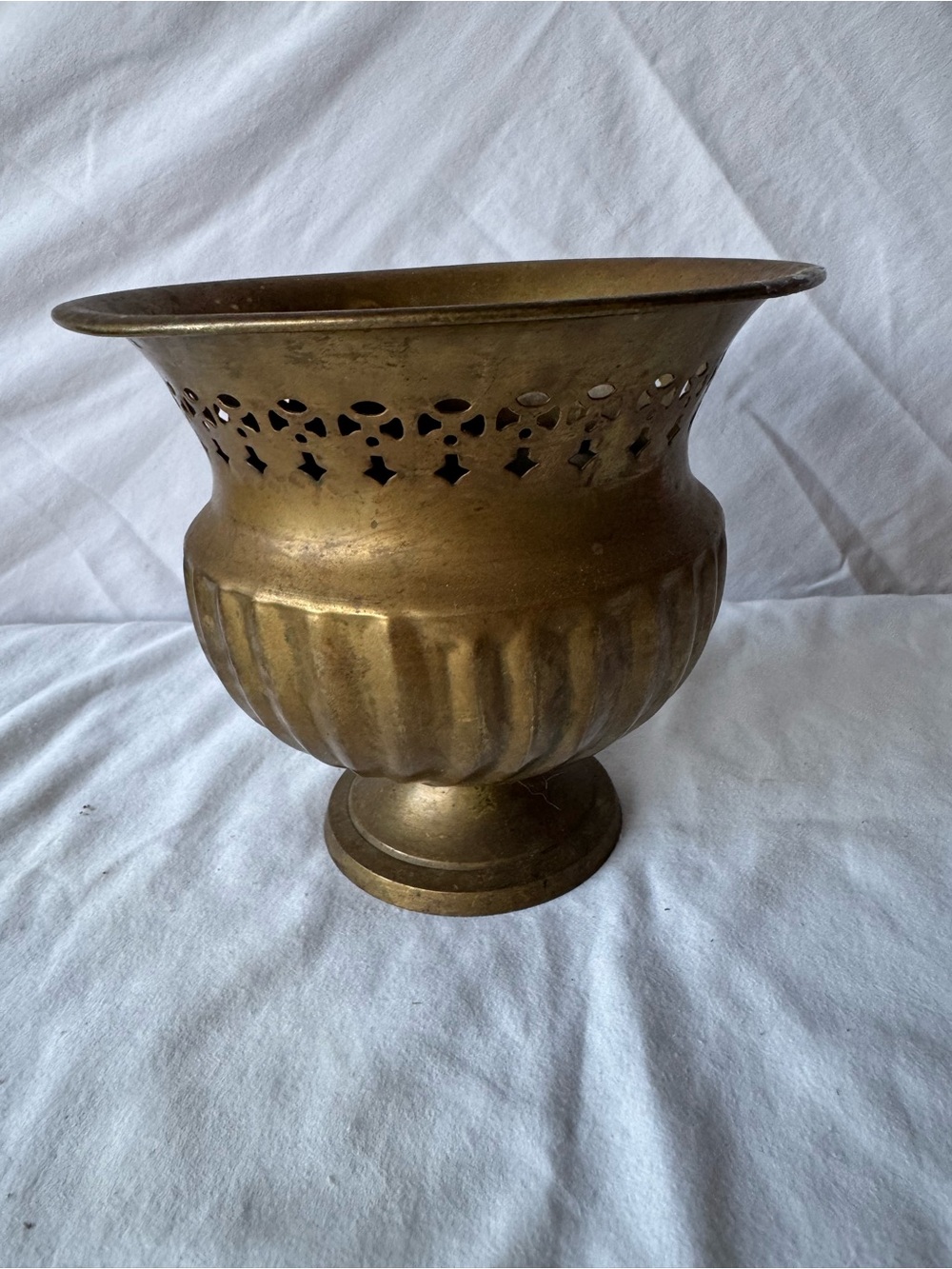 vintage brass footed jardiniere or planter featuring a decorative pierced lattic